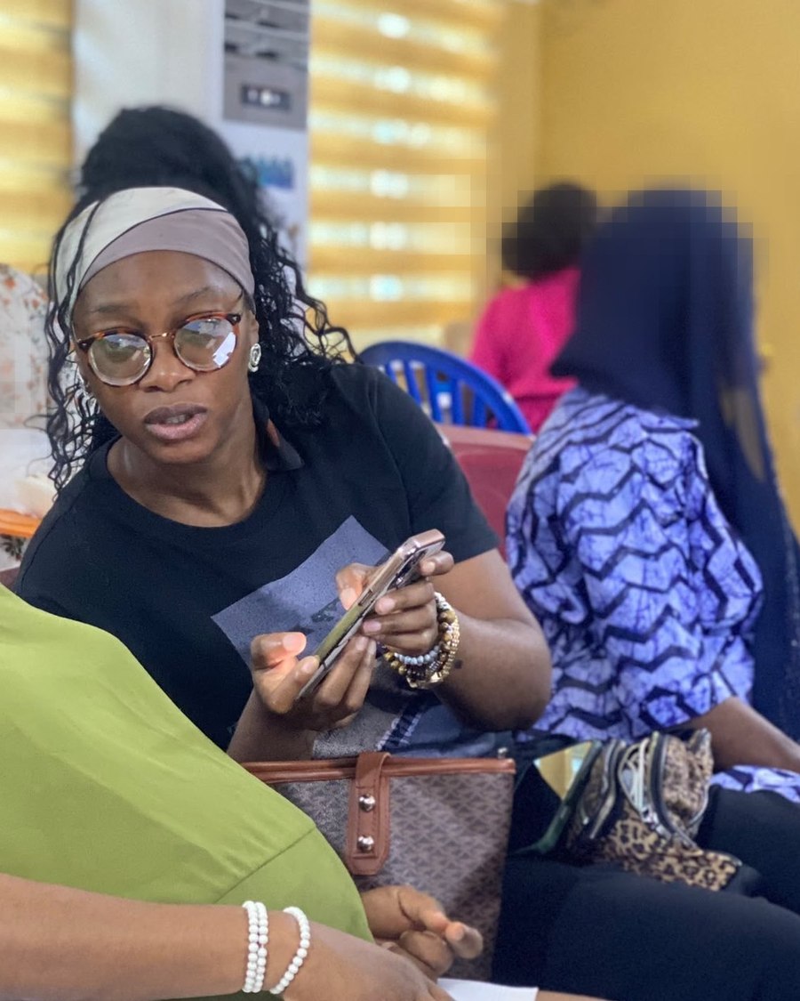 Peace Njoku collecting data with a participant