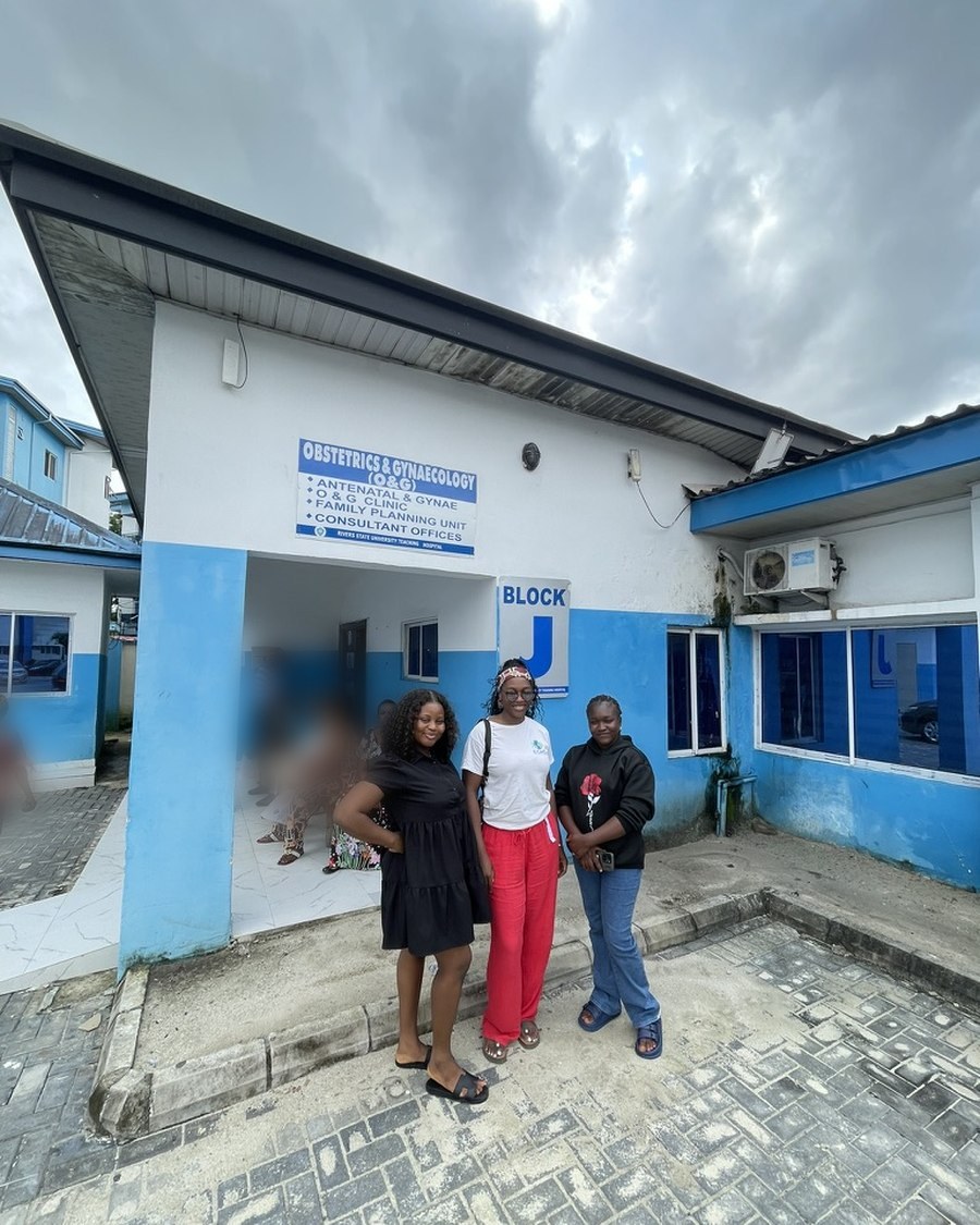 Peace Njoku and colleagues outside the Obstetrics and Gynaecology clinic